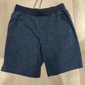Lululemon men’s shorts. Unlined, navy blue heather color.